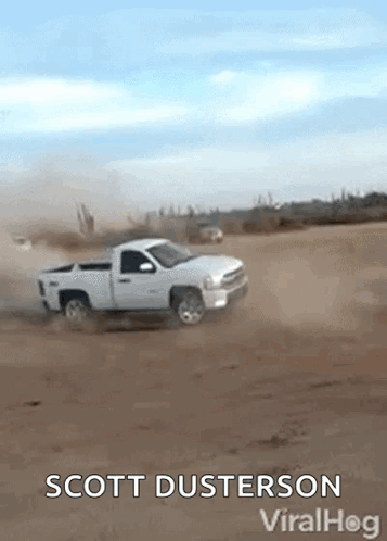 A White Truck Is Driving Through A Dirt Field With The Words Scott Dusterson Viralhog Below It GIF