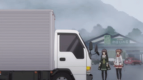 A White Truck Is Parked In Front Of A Building With A Sign That Says " Store " On It GIF