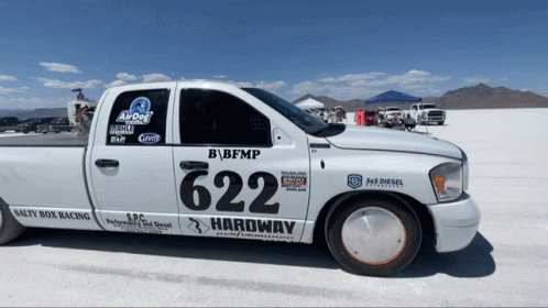 A White Truck With The Number 624 On The Side Of It GIF