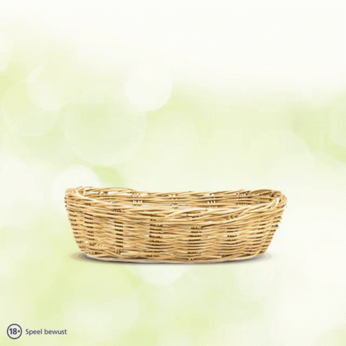 A Wicker Basket Filled With Golden Eggs And The Words Speel Bewust Below GIF