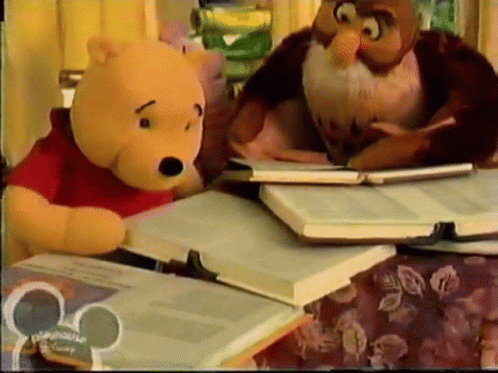 A Winnie The Pooh And An Owl Sit At A Table With Books GIF