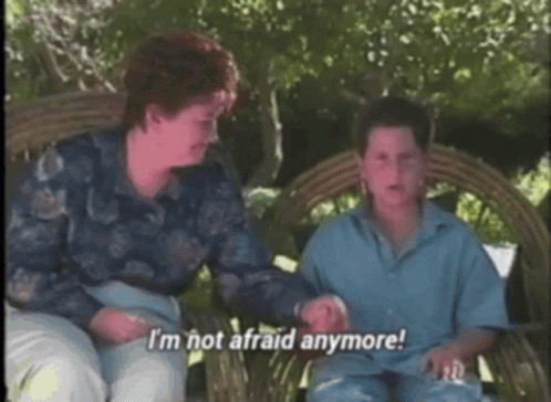 A Woman And A Boy Are Sitting On A Wicker Bench And The Boy Says I 'M Not Afraid Anymore GIF