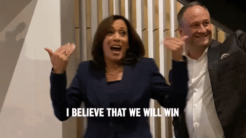 A Woman And A Man Are Celebrating And The Woman Is Saying I Believe That We Will Win GIF