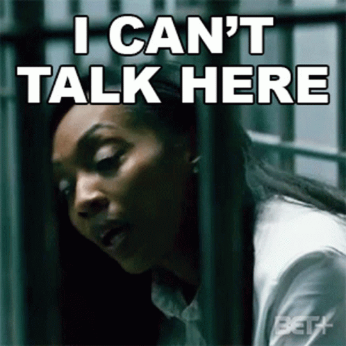 A Woman Behind Bars With The Words I Can T Talk Here GIF
