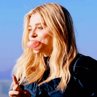 A Woman Blowing A Bubble With Her Tongue GIF