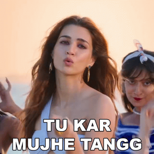 A Woman Blowing A Kiss With The Words Tu Kar Mujhe Tangg Written Below Her GIF