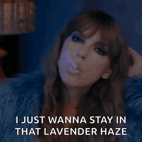 A Woman Blowing A Purple Bubble With The Words " I Just Wanna Stay In That Lavender Haze " Below Her GIF
