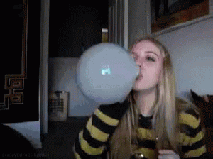 A Woman Blowing Up A Bubble With A Macbook Logo On It GIF