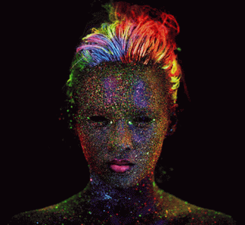 A Woman Covered In Glow In The Dark Paint GIF