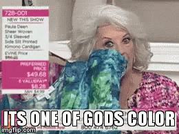 A Woman Covering Her Face With A Sweater That Says It 'S One Of Gods Color On It GIF
