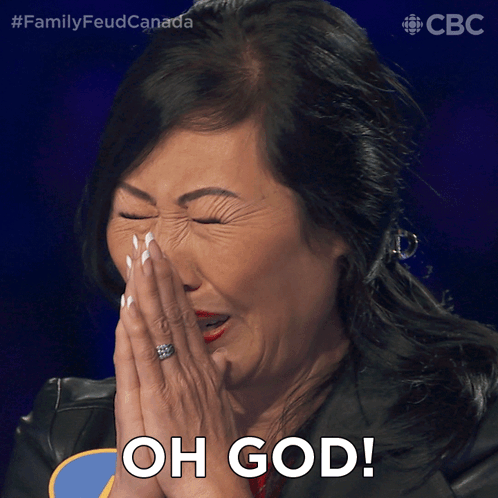 A Woman Covering Her Face With Her Hands And The Words Oh God On The Bottom GIF