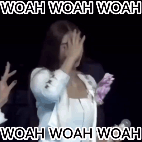 A Woman Covering Her Face With Her Hands With The Words Woah Woah Woah In White Letters GIF