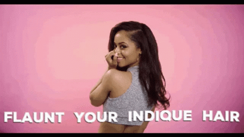A Woman Covering Her Nose With Her Hand With The Words Flaunt Your Indicque Hair Written Below Her GIF