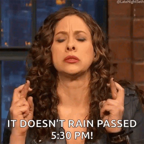 A Woman Crosses Her Fingers And Says It Does N't Rain Passed 5:30 Pm . GIF