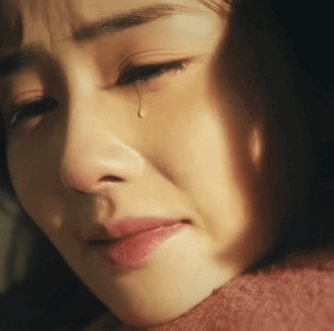 A Woman Crying With A Tear Coming Out Of Her Eye GIF
