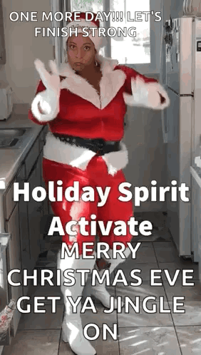 A Woman Dressed As Santa Claus Is Dancing In A Kitchen With A Christmas Message . GIF