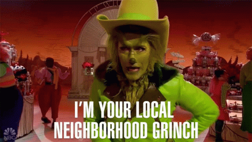 A Woman Dressed As The Grinch Says " I 'M Your Local Neighborhood Grinch " In Front Of A Crowd GIF