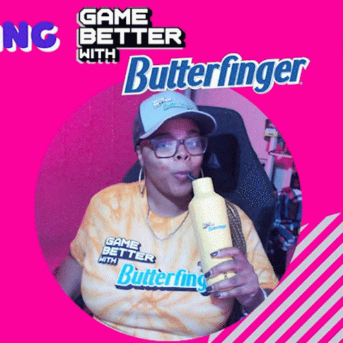 a woman drinking from a yellow bottle with the words game better with butterfinger on the bottom