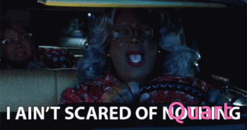 A Woman Driving A Car With The Words " I Ain T Scared Of Nothing " GIF