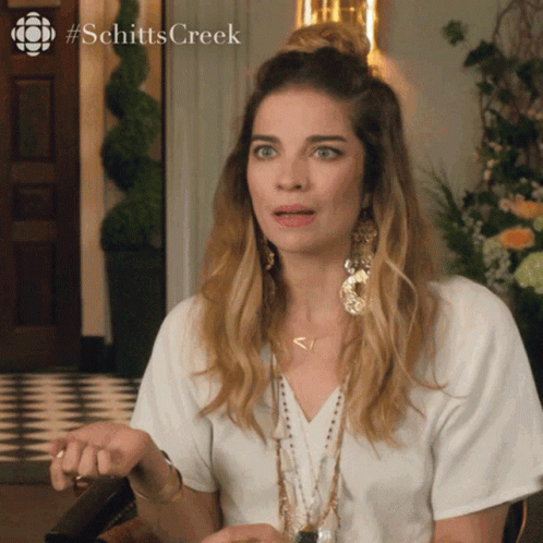 A Woman From Schitts Creek Making A Surprised Face GIF