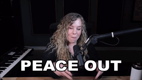 a woman giving a peace sign in front of a microphone with the words peace out written below her