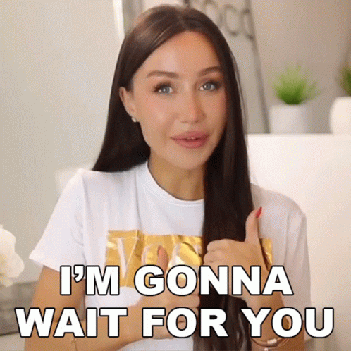 A Woman Giving A Thumbs Up With The Words I 'M Gonna Wait For You Behind Her GIF