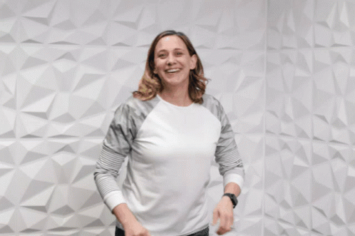 A Woman Giving A Thumbs Up With The Words " You 'Re Awesome " Behind Her GIF
