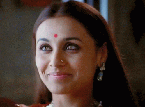 A Woman Has A Red Dot On Her Forehead GIF