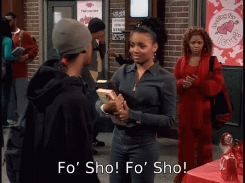 A Woman Holding A Book Says " Fo Sho " In Front Of A Sign That Says " Feeling For Love " GIF