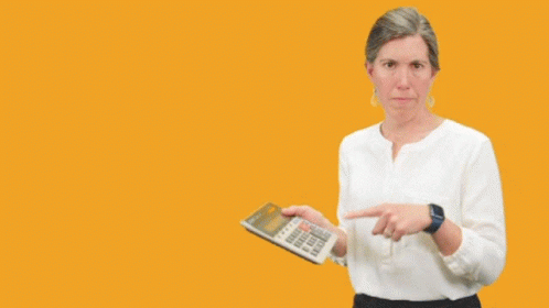 A Woman Holding A Calculator With The Words But Give Me The Cost GIF