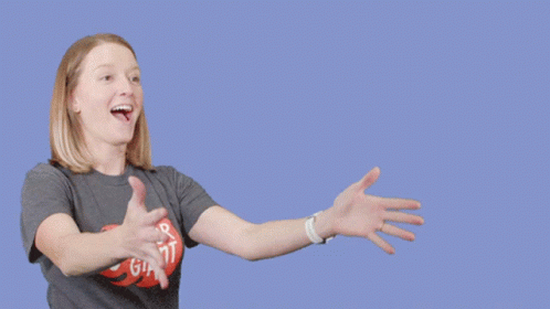 A Woman Holding A Cardboard Box That Says Fragile GIF