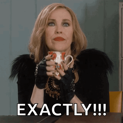 A Woman Holding A Cup Of Coffee With The Words Exactly Written Below Her GIF