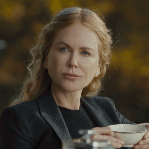 A Woman Holding A Cup Of Coffee With The Words I Didn 'T Written Below Her GIF