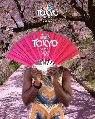 A Woman Holding A Fan That Says Tokyo 2020 GIF