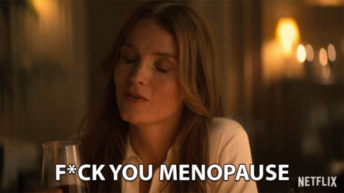 A Woman Holding A Glass Of Wine Says F * Ck You Menopause GIF