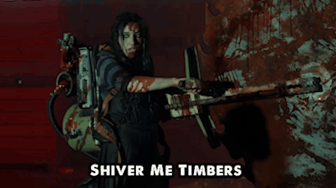 A Woman Holding A Gun With The Words Shiver Me Timbers Written Below Her GIF
