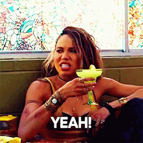 A Woman Holding A Margarita With The Word Yeah Above Her GIF