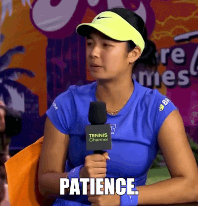 A Woman Holding A Microphone That Says Patience GIF