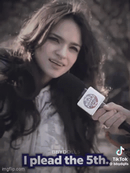 A Woman Holding A Microphone With The Words I Plead The 5Th GIF