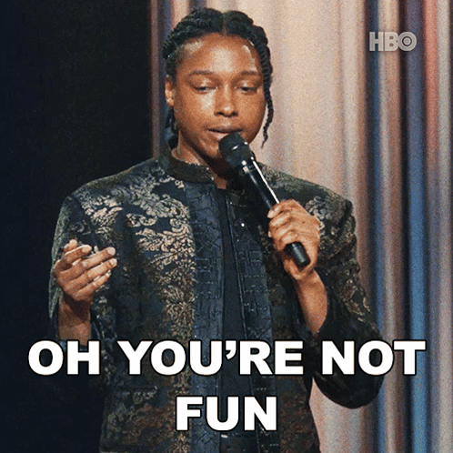 A Woman Holding A Microphone With The Words Oh You 'Re Not Fun Behind Her GIF