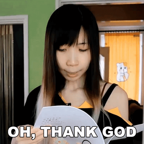 A Woman Holding A Piece Of Paper With The Words Oh Thank God Written On It GIF