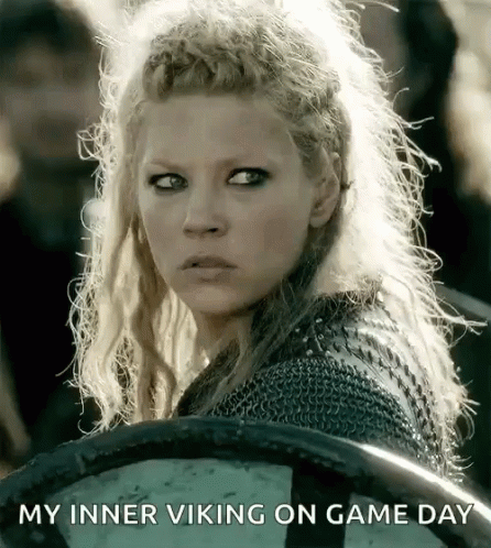 A Woman Holding A Shield With The Words " My Inner Viking On Game Day " Written Below Her GIF