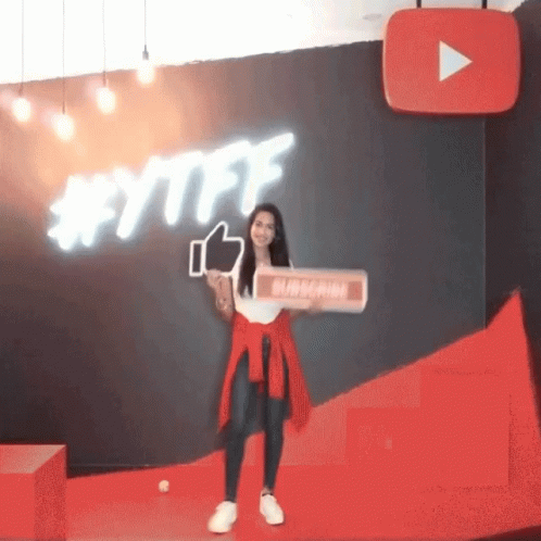 A Woman Holding A Sign That Says Subscribe GIF