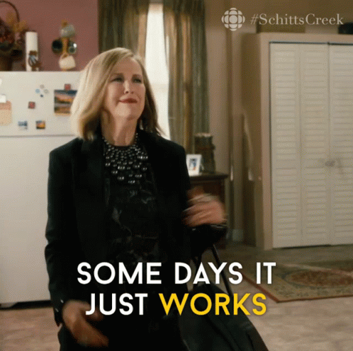 A Woman Holding A Suitcase With The Words Some Days It Just Works Below Her GIF