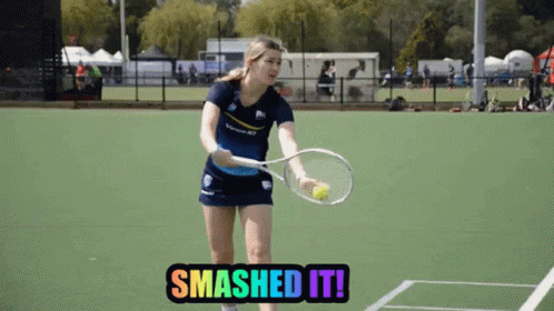 A Woman Holding A Tennis Racquet On A Tennis Court With The Words Smashed It GIF
