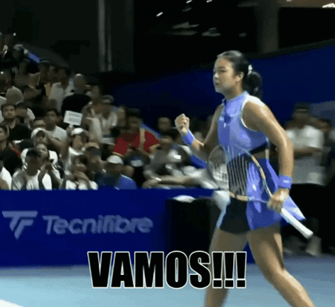 A Woman Holding A Tennis Racquet With Vamos Written On The Bottom GIF