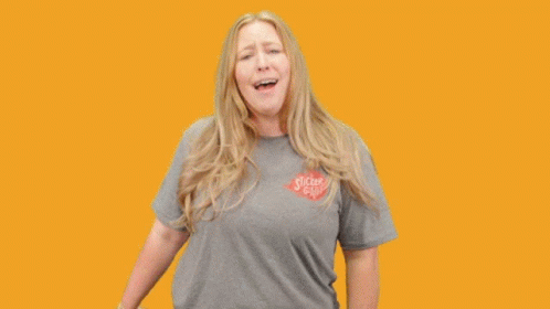 A Woman Holding A Unicorn Sticker With The Words You 'Re A Unicorn GIF