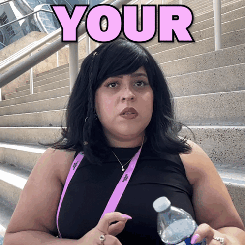 a woman holding a water bottle with the word your above her head