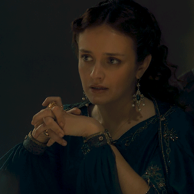 A Woman Holding A Wine Glass With The Words Of Course Written Below Her GIF