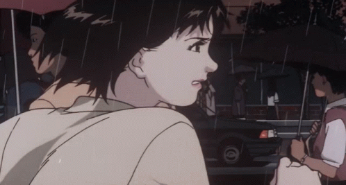 A Woman Holding An Umbrella Is Walking In The Rain GIF